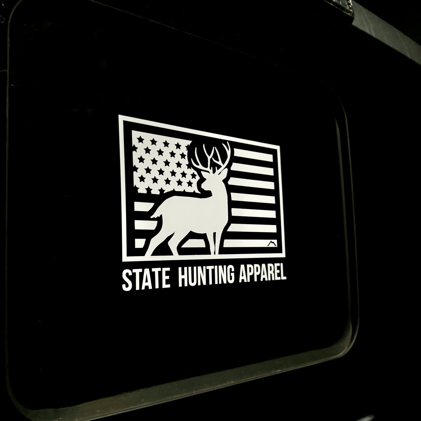 7" x 5" USA Buck Design Window Decal with the words "State Hunting Apparel" on a truck rear window 